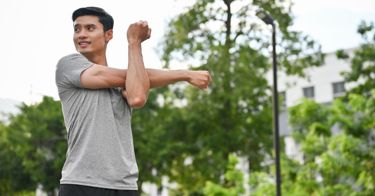Man stretching before going on a run.
